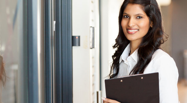 woman walking through open door