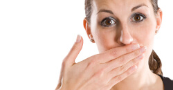 Woman covering mouth