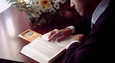 man reading Bible