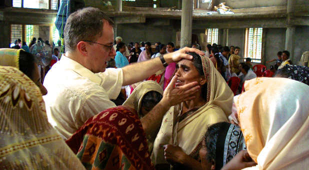Lee Grady, founder of The Mordecai Project, ministers a group of women in India.