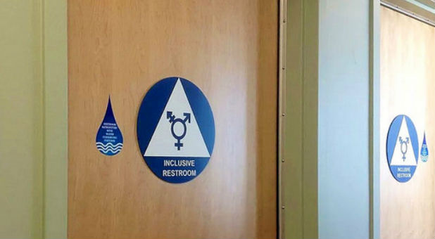 A Minnesota judge has ruled that a national check-print company must pay $115,000 and apologize to a transgender