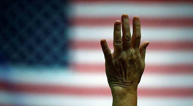Hand Raised in Prayer