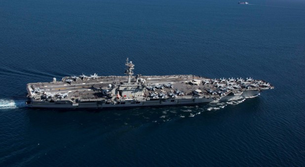 The Nimitz-class aircraft carrier USS Abraham Lincoln (CVN 72) transits the Strait of Gibraltar, entering the Mediterranean Sea as it continues operations in the 6th Fleet area of responsibility.
