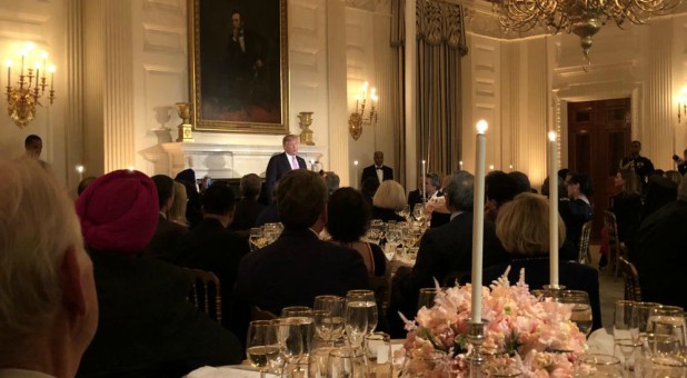 President Donald Trump greets guests at the annual White House National Day of Prayer Dinner Wednesday night.