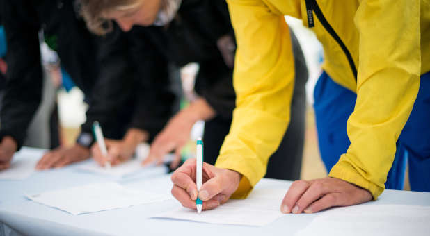 People signing a petition.